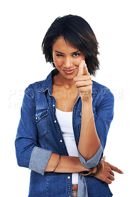 Buy stock photo Flirty, decision and portrait of a black woman pointing a finger on a white background in studio. Smile, motivation and happy African model with a wink, choice and excited on a studio background