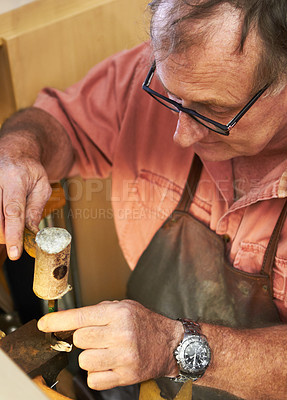 Buy stock photo Cropped view of a manufacturing jeweler using a leather mallet