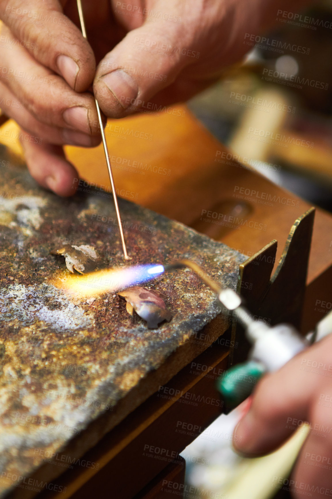 Buy stock photo Hands, jewelry and closeup of torch metal for creative art
manufacturing, steel process in workshop. Fingers, expert and equipment for silver heating or handmade business, flame craft or iron design