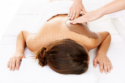 Buy stock photo Woman, mud massage and therapist for body, back and spa for physical therapy and chocolate treatment. Sleeping, masseuse and wellness with luxury, peaceful and hands on white studio background
