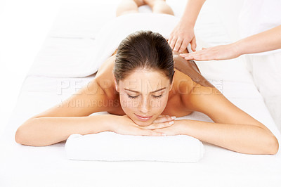 Buy stock photo Happy woman, relax and mud massage for zen or mental wellness on bed at luxury resort or salon. Calm female person or model smile for body therapy, beauty treatment or stress relief