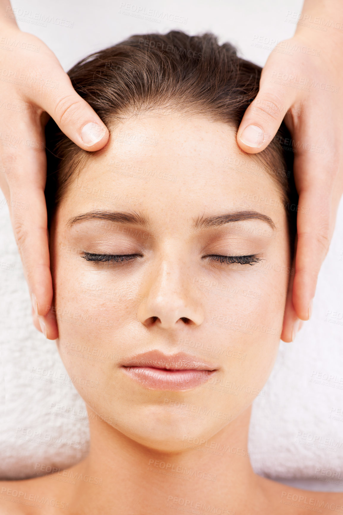Buy stock photo Spa massage, relax and hands on face of woman from above at a resort for stress relief or wellness. Top view, facial and female with masseuse at a beauty salon for luxury, skincare or dermatology