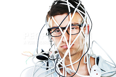 Buy stock photo Studio portrait of a young man with cables hanging over his head isolated on white