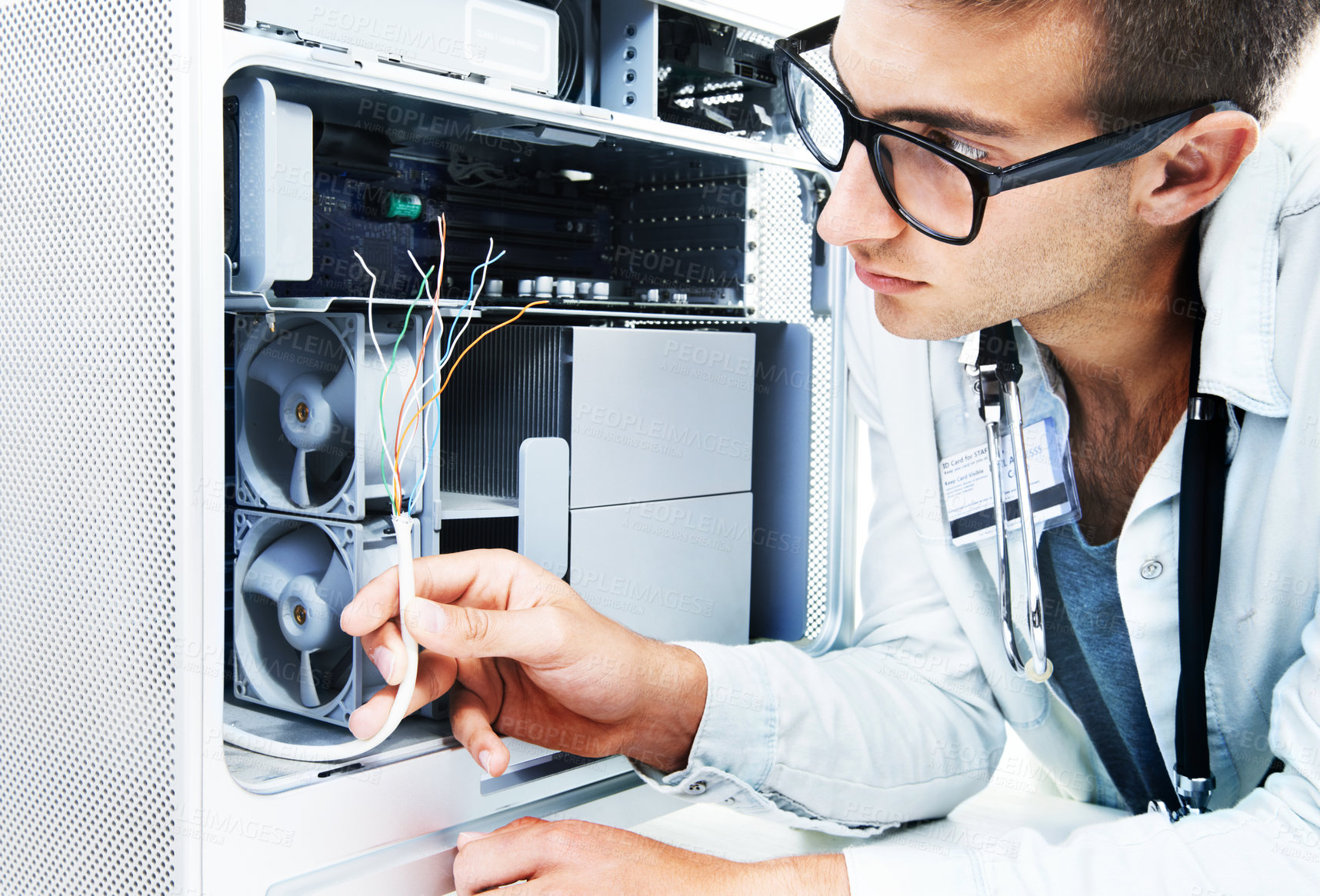Buy stock photo Computer tower, wires and man fixing studio hardware, electronics or check machine electrical power damage. Maintenance, technician analysis and IT specialist problem solving on white background
