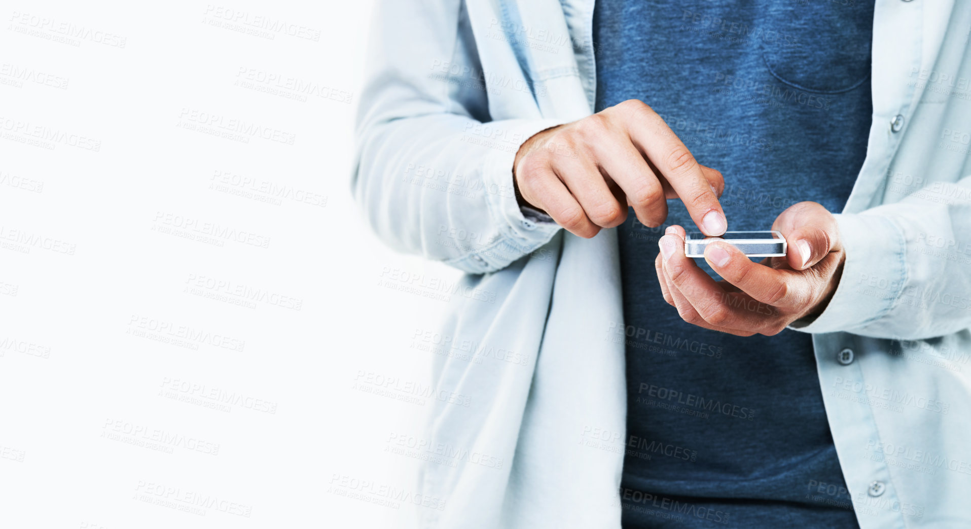 Buy stock photo A cropped image of a casual male typing on his cellphone