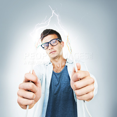 Buy stock photo Man, glasses and wires for cable in studio for electricity, spark or danger mockup on gray background. Portrait, technician or electrician by career for fixing, glitch or 404 on internet, web or app