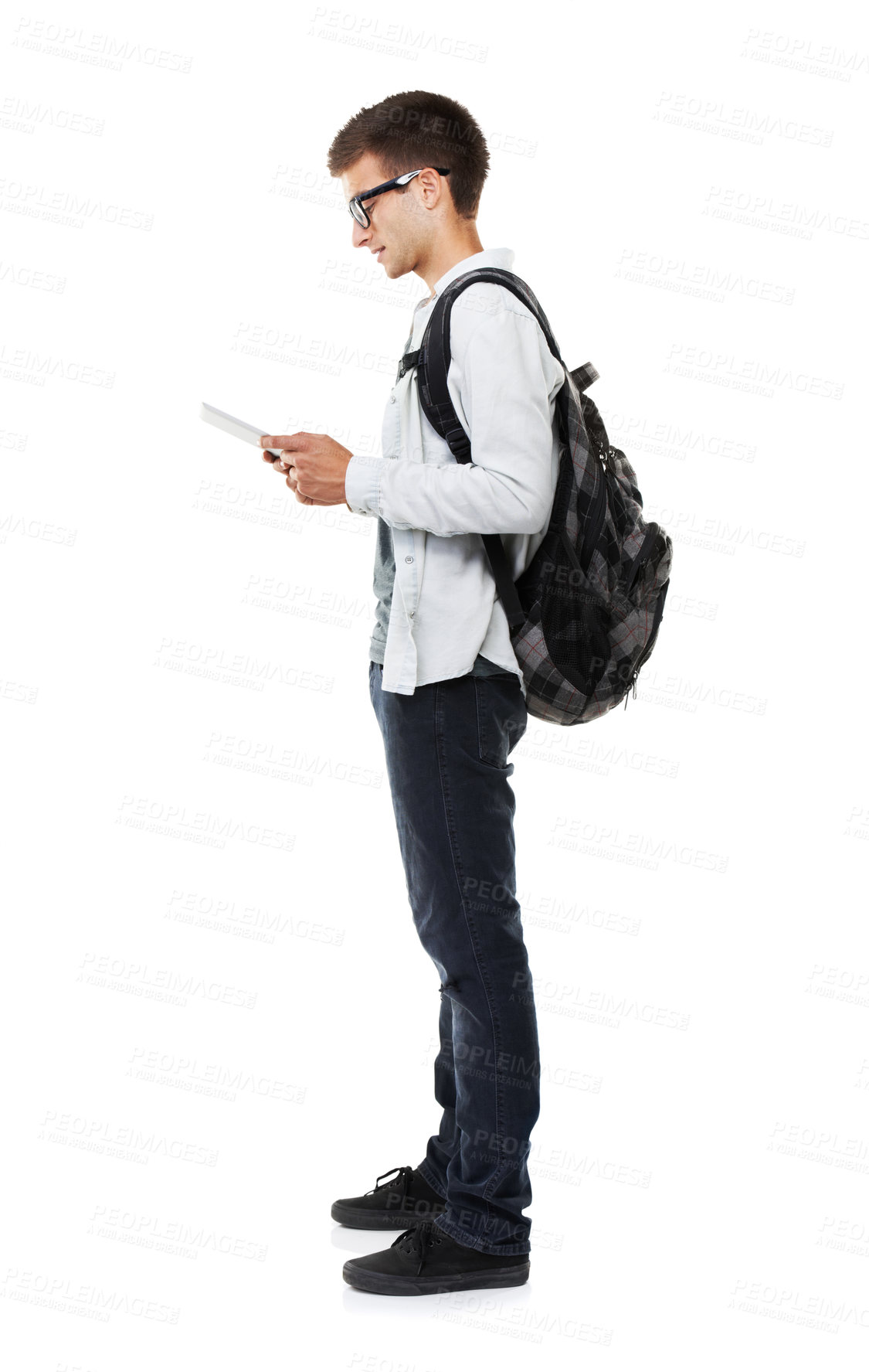 Buy stock photo Student, tablet and backpack for online education, e learning and college or university registration in studio. Young man reading ebook, school research and digital technology on a white background