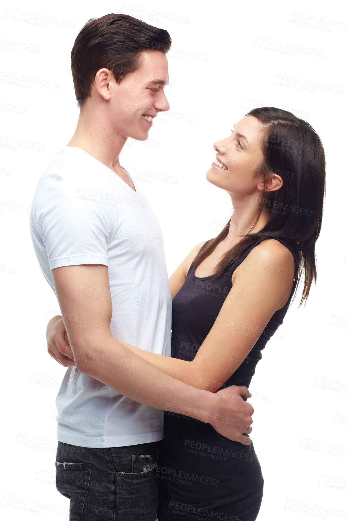 Buy stock photo Woman, man and hug for love in studio, laughter as gen z with care and commitment in mockup space. Young couple, happy and smile for marriage, embrace and relationship bonding by white background
