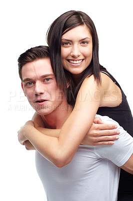 Buy stock photo A beautiful young woman being carried by her boyfriend while isolated on white