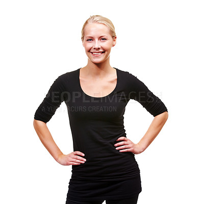 Buy stock photo Portrait of a smiling young woman with her hands on her hips, isolated on white