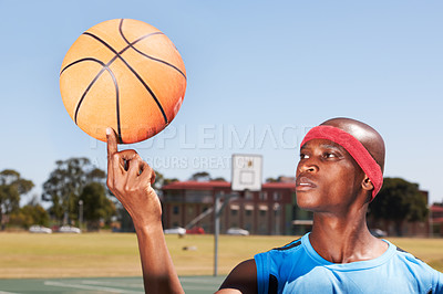 Buy stock photo Black man balance basketball on finger, sports and exercise at outdoor court training, workout or fitness energy. African athlete spinning ball, competition mockup and serious concentration in game