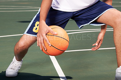 Buy stock photo Man, legs and basketball on court for playing, training or workout with performance and wellness. Athlete, person or ball for sport, exercise or technique with fitness, skill and sports match outdoor