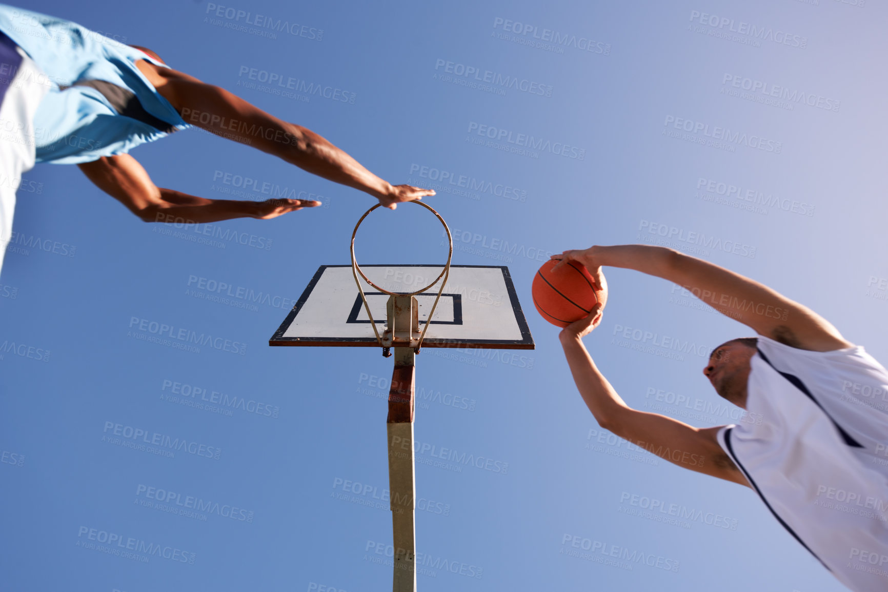 Buy stock photo Men, player and basketball game at outdoor court or low angle of challenge team, dunk on rival. Male people, hoop or score point in summer park on fitness match or competition, athlete at blue sky
