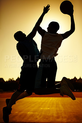 Buy stock photo Sunset, basketball team and jumping silhouette with sport, fitness ad exercise outdoor on court with game. Dunk, athlete and challenge of player training and workout match and competition with aim