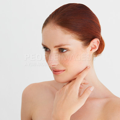 Buy stock photo Skincare, thinking and woman touch face in white background, isolated studio and natural beauty. Female model, facial glow and makeup cosmetics for aesthetic dermatology, self love and transformation