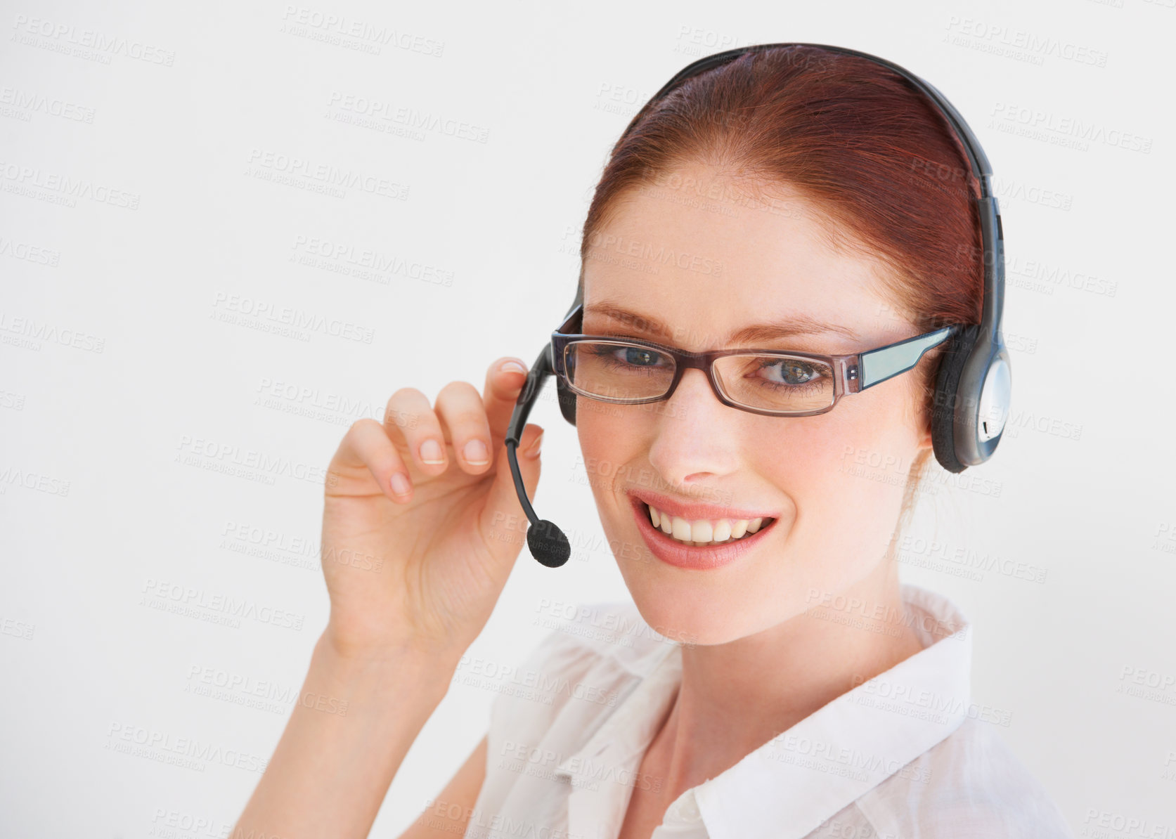 Buy stock photo A young telemarketer talking on her headset