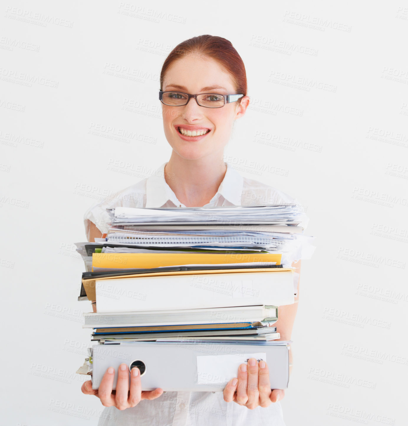 Buy stock photo A student carrying a pile of files and books