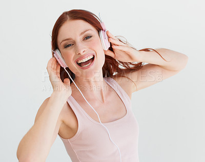 Buy stock photo Woman, headphones and studio portrait with smile for music, streaming subscription or podcast by background. Isolated girl, student or model with happiness for audio, sound and internet radio by wall