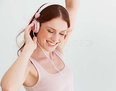Buy stock photo Happy woman, dance and headphones in white background, isolated studio and freedom of celebration, good mood and energy. Excited female model, dancing and listening to music, audio and radio sound 