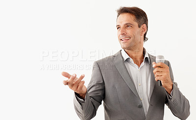 Buy stock photo Man, microphone and smile in speech, studio and motivational or public speaker, tv and white background. Happy mature person, broadcast and feedback or voice, anchor and media or influencer in mockup
