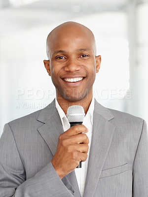 Buy stock photo African man, microphone and portrait with smile, speaking and working at event, happy and employee. Speech, career and workplace for corporate seminar, speaker and hosting for business conference