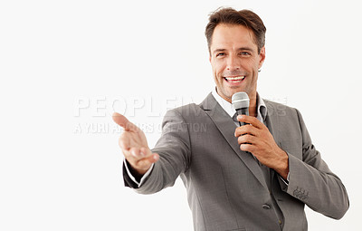 Buy stock photo Portrait, microphone and a man motivational speaker in studio isolated on a white background for a presentation. Leadership, management and motivation with a business man talking during a seminar