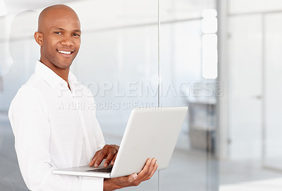 Buy stock photo Portrait, business and black man with laptop in office to work on career or job with pride. Computer, male entrepreneur and African person from Nigeria in professional workplace with smile on mockup
