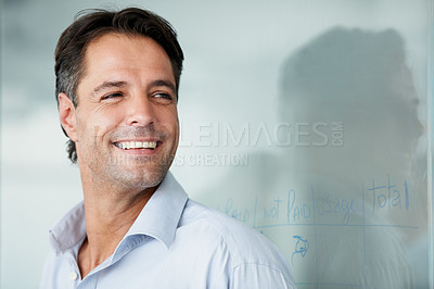 Buy stock photo Happy businessman, face and smile for vision, ambition or success on mockup at the office. Man employee smiling in happiness for career goals, planning or corporate achievement at the workplace