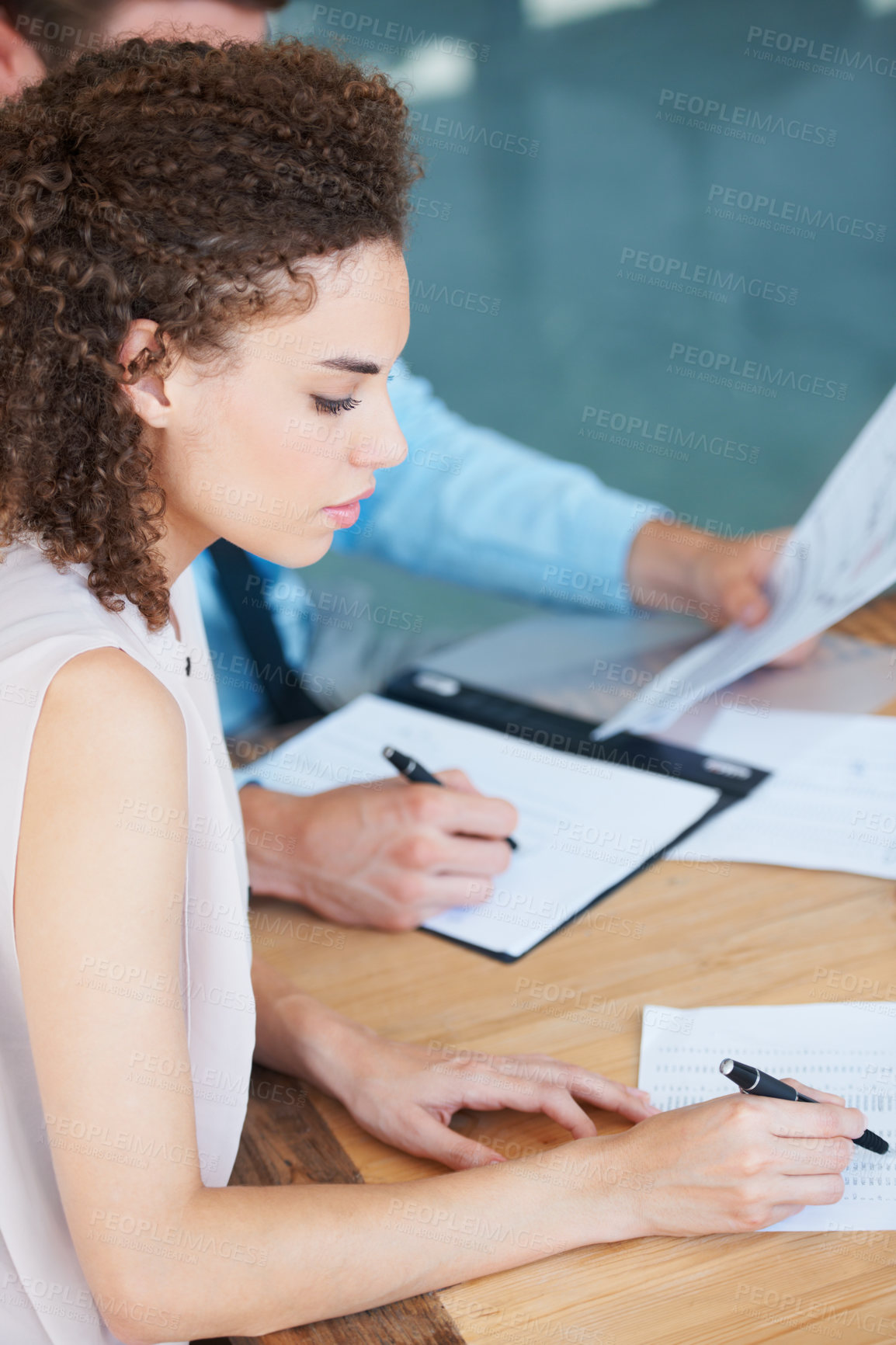 Buy stock photo Business woman, writing and documents in meeting for finance, accounting or planning budget on office desk. Female accountant working on financial report, paperwork or accounts with pen at workplace