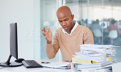Buy stock photo Stress, documents and burnout with a business black man in an office, sitting at a desk while working on a problem. Audit, tax and compliance with a young male employee suffering from anxiety at work