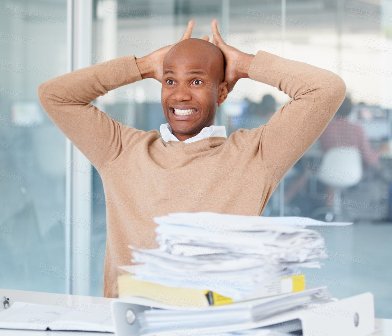 Buy stock photo Stress, documents and mistake with a business man in his office, sitting at a desk while working on a problem. Audit, tax and compliance with a black male employee suffering from burnout at work
