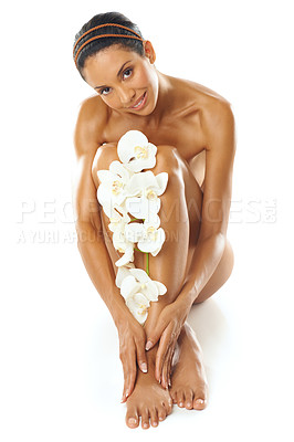 Buy stock photo Skincare, beauty and portrait of woman with flowers in studio on a white background mock up. Floral cosmetics, organic makeup and female model with orchids on legs for skin treatment and body care.