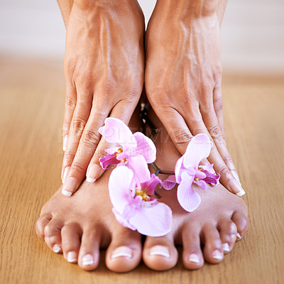 Buy stock photo Skincare girl and hands with flowers on feet for luxury cosmetic treatment with manicure and pedicure nails. Healthy skin of black woman with orchid for beauty, wellness and pamper lifestyle.

