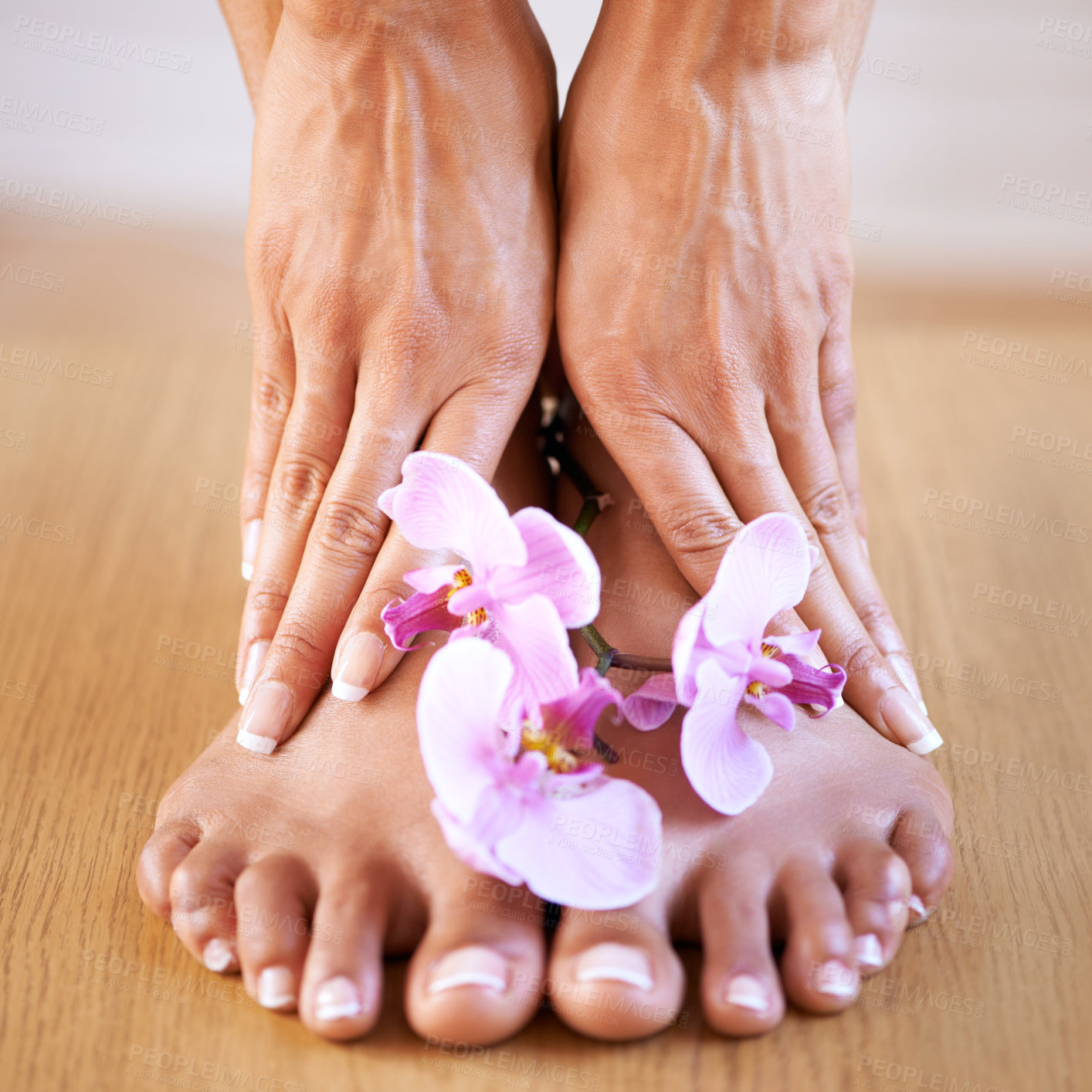 Buy stock photo Skincare girl and hands with flowers on feet for luxury cosmetic treatment with manicure and pedicure nails. Healthy skin of black woman with orchid for beauty, wellness and pamper lifestyle.

