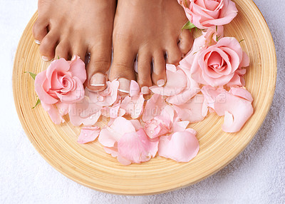 Buy stock photo Pedicure, beauty and feet of a woman with flowers for cleaning, treatment and detox. Spa, dermatology and above foot of a model with a floral, cosmetic and natural grooming with roses for luxury