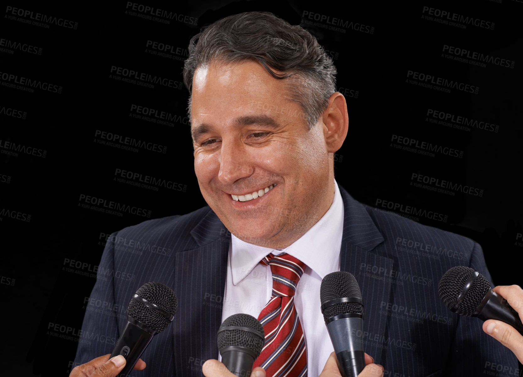Buy stock photo Man, speech and politician at press conference to media for election, forum or broadcast to audience in studio on black background. Politics, government and happy public speaker talking at microphone