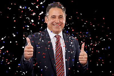 Buy stock photo Business man, thumbs up and confetti for celebration, success and winning, thank you or support in election in studio. Portrait of professional winner in suit, like emoji and vote on black background