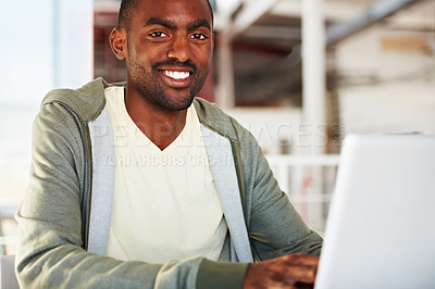 Buy stock photo Portrait of a young african man working on his laptop