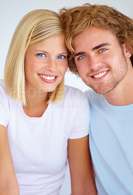 Buy stock photo Portrait, love and smile with a young couple together in their home on the weekend for romance or to relax. Face, happy or dating with a man and woman bonding in their apartment for wellness