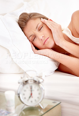 Buy stock photo Headache, alarm and woman in bed in morning wake up with insomnia, exhausted and no sleep at home. Depression, sadness and annoyed female person with migraine, head pain and stress for bedroom clock