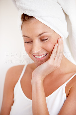 Buy stock photo A lovely young woman feeling her smooth skin after a refreshing shower