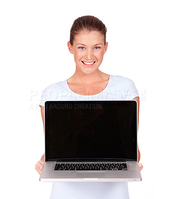 Buy stock photo A lovely young woman presenting a top of the line laptop to you - isolated