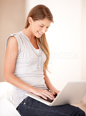 Buy stock photo Relax, laptop and reading with woman on sofa in living room for social media, streaming and website. Search, technology and digital with female user typing at home for connection, email and internet