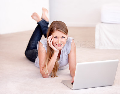 Buy stock photo Laptop, relax and portrait of a woman on the floor browsing on social media, website blog or the internet. Happy, smile and female person laying on the ground with computer for entertainment at home.