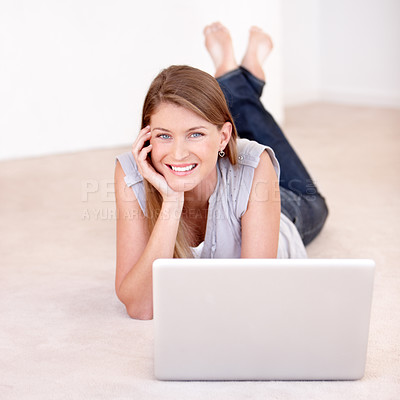 Buy stock photo Laptop, portrait and woman laying on the floor browsing on social media, website blog or the internet. Happy, smile and female person relaxing on the ground with a computer for entertainment at home.