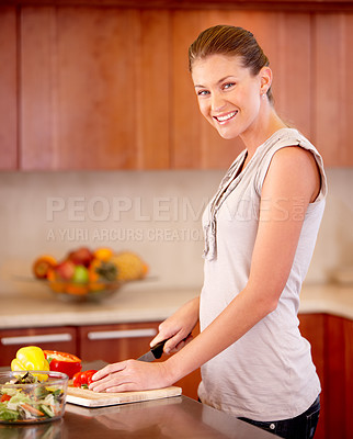 Buy stock photo Woman, portrait and knife for cutting pepper with smile, vegetables or nutrition in home kitchen for health. Girl, happy chef and vegetable for food, wellness and diet in apartment with healthy lunch