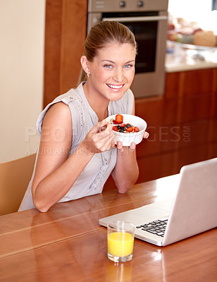 Buy stock photo Laptop, portrait and woman with fruit breakfast in home for website, internet and reading news blog. Smile, morning and person on computer for connection, networking and streaming service in kitchen