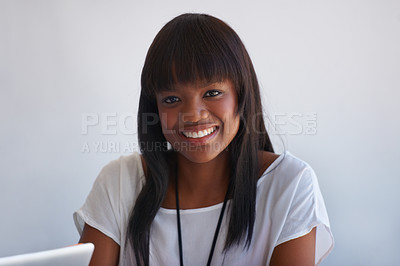 Buy stock photo Happy, motivation and smile of a black intern and business woman working in a creative office. Portrait of a shy, smiling and ambitious entrepreneur enjoying her internship at a startup company