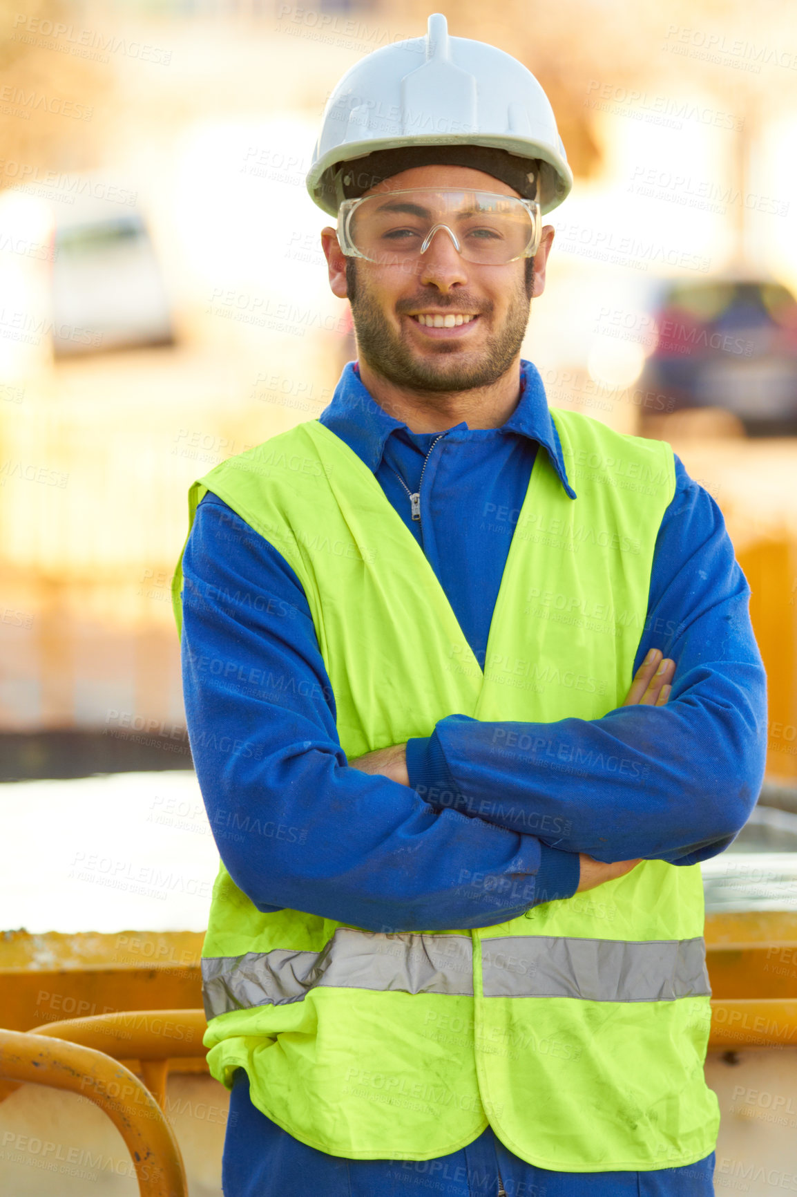 Buy stock photo Portrait of a construction worker wearing protective glasses and smiling at you