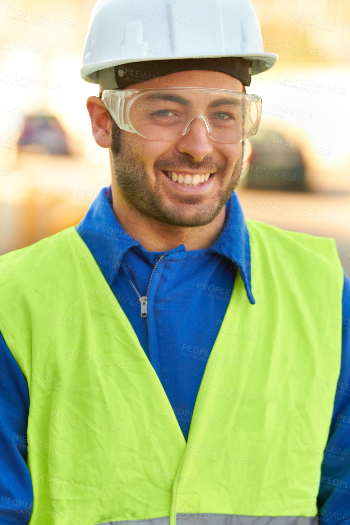 Buy stock photo Portrait of a construction worker wearing protective glasses and smiling at you